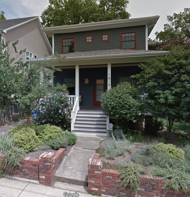 color photo of the front of a dark green house, two full stories • Sears Sunlight, built in 1928, at 1815 N Stafford St, Arlington, Virginia