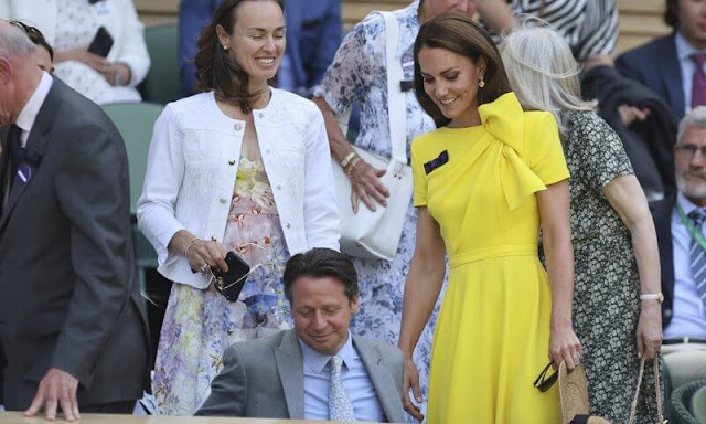 Kate Middleton wore a yellow Brigitte dress by Roksanda. Kazakhstan's Elena Rybakina and Tunisia's Ons Jabeur