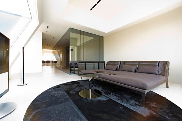 Photo of black bed in the bedroom of one of the modern New York penthouses