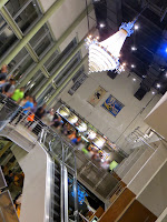 Picture of Angelika's interior, showing staircases, chandeliers, and where to buy food.