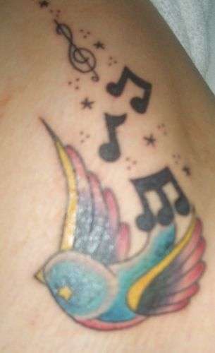 small bird tattoo. music tattoo. i love music