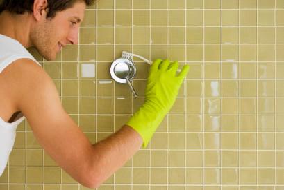Wanna Score? You Have To Scour - man cleaning washing wall bathroom