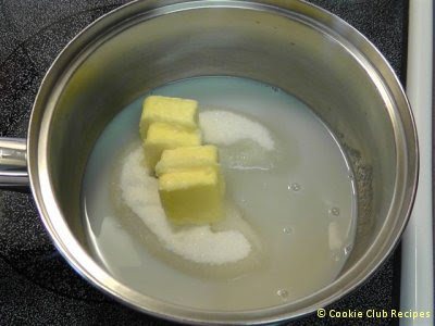 pot of sugar, milk, and butter cooking on stove