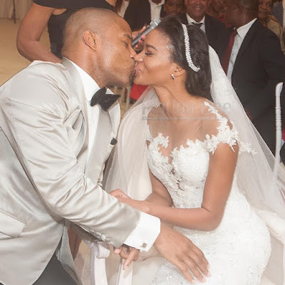 Mr and Mrs Osi Umenyiora share a kiss at their wedding