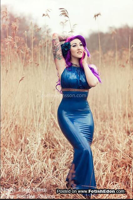 Inked Elegy Ellem hot purple-haired woman wearing blue latex dress