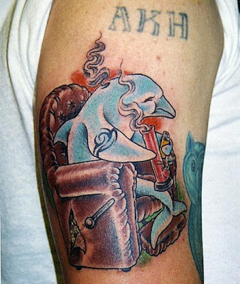 Tattoos: Neck “Carlitos Jr” – Left Arm “Brown Pride” – Right Arm “Surenos”