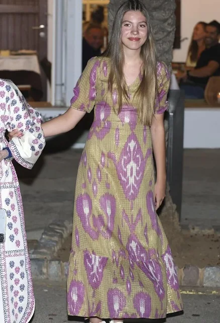 Queen Letizia wore a red pleated halter-neck dress by Mango. Infanta Sofia wore an Ikat Arles dress by Babbaki