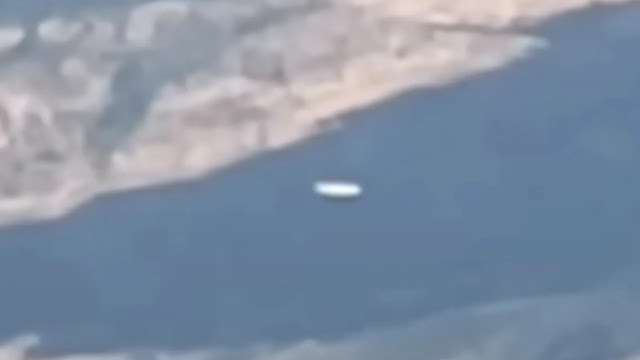 Zoomed in closer look at the UFO sighting filmed from the window of an airplane over South America.