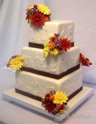 A three tier white wedding cake delivered to the Olde Mill Inn at Basking