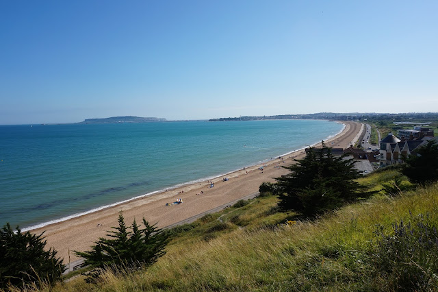 View of a beach, sea, grass near Weymouthy Dorset