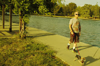 Man with dog at Lake BalBoa in la COUNTY