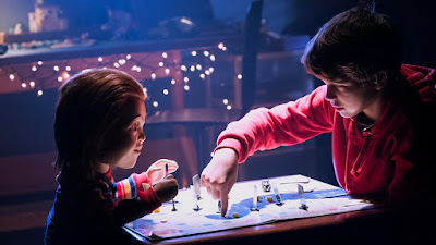 Andy, played by Gabriel Bateman, and Chuck, voiced by Mark Hamill, play a game together in the new horror film Child's Play