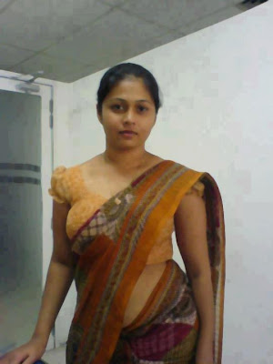 Indian aunt posing after wearing saree.