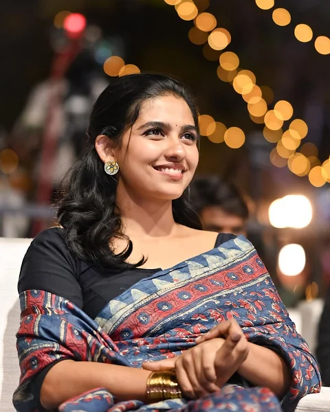 Mamitha Baiju in a blue cotton saree and black blouse smiling