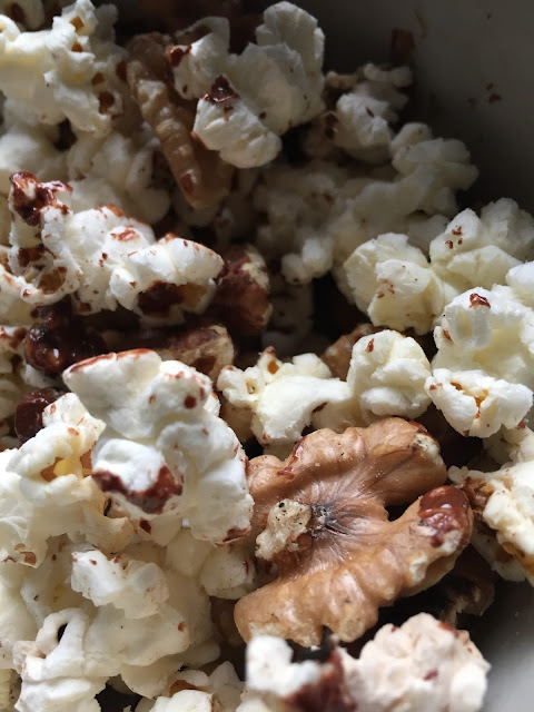 homemade popcorn with walnuts, dark chocolate and a hint of salt