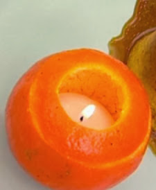 http://www.hogarutil.com/decoracion/manualidades/otros/201203/como-hacer-velas-mandarina-14242.html