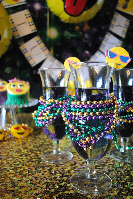 Hurricane's at an emojinal Mardi Gras party by Fizzy Party. 
