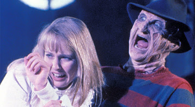 Freddy Kruger (Robert Englund) grabs Alice (Lisa Wilcox) so he can torture her in a movie scene for the film A Nightmare on Elm Street 5: The Dream Child