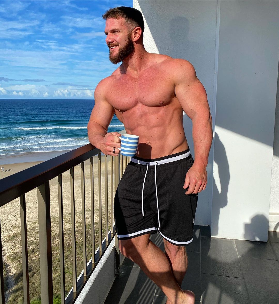 hot-shirtless-man-matt-oreilly-strong-body-beard-daddy-building-balcony-view