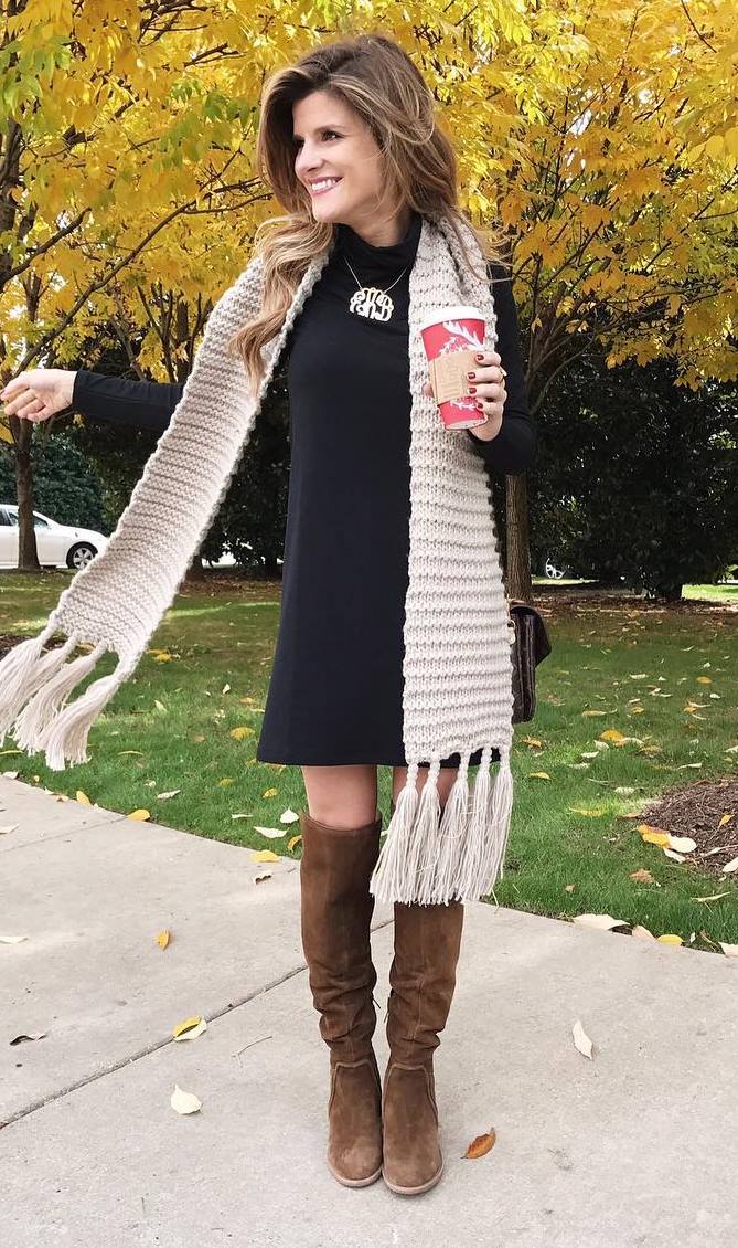 trendy fall outfit : knit scarf + black dress + high brown boots