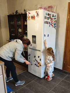 Tidying the magnets on the fridge