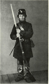 Pvt. Geo. Atkinson, born Yorkshire, England, enlisted in Yankee army at age 41 on 21 Aug. ’62 at Ft. Snelling, Minn, in Co. F, 9th Minn. Vol. Infy, as a 3-years man. He was issued at that time an Austrian Lorenz M1854-5 rifle a tige with leaf rear sight and typical quadrangular bayonet. Photo from Kay Fritz Archive collection.