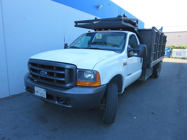 Flat bed construction vehicle after collision repairs at Almost Everything Auto Body