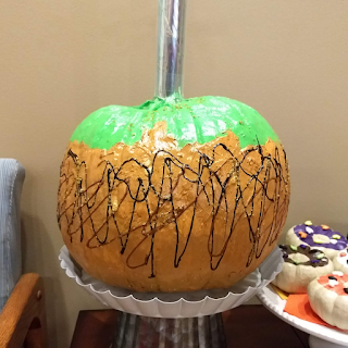 Photo of pumpkin decorated as a Carmel Apple