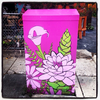 utility box mural painted near stony brook station in jamaica plain boston a mural of lilies and lotus with a pretty purplish fuchsia background