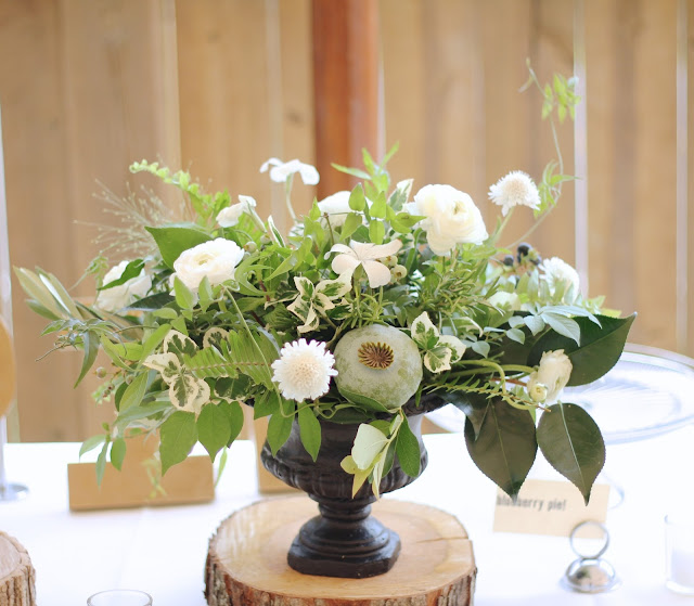 Suzy and joe's wedding was the perfect opportunity to design with locally grown flowers from Detroit farms like Fresh Cut flower farm and Ann arbors Seeley farms.  These have got to be some of my all time favorite centerpieces and bouquets with lush textured foliages including home grown jasmine vine, wild blueberry, variegated pittospurmum, rosemary, explosion grass camellia, ferns, and olive branches,  The giant poppy pods gave each piece its focal point and the wild scabiosa and ranunculus prettied it all up.  sweet pea floral design ann arbor detroit black stone urn compote garden centerpiece jammable garden vase.