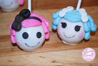 Cake pops that look like Lalaloopsy cake doll heads.