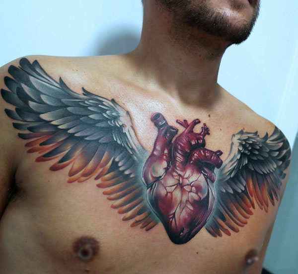 Anatomical heart with wings colorful tattoo ideas 