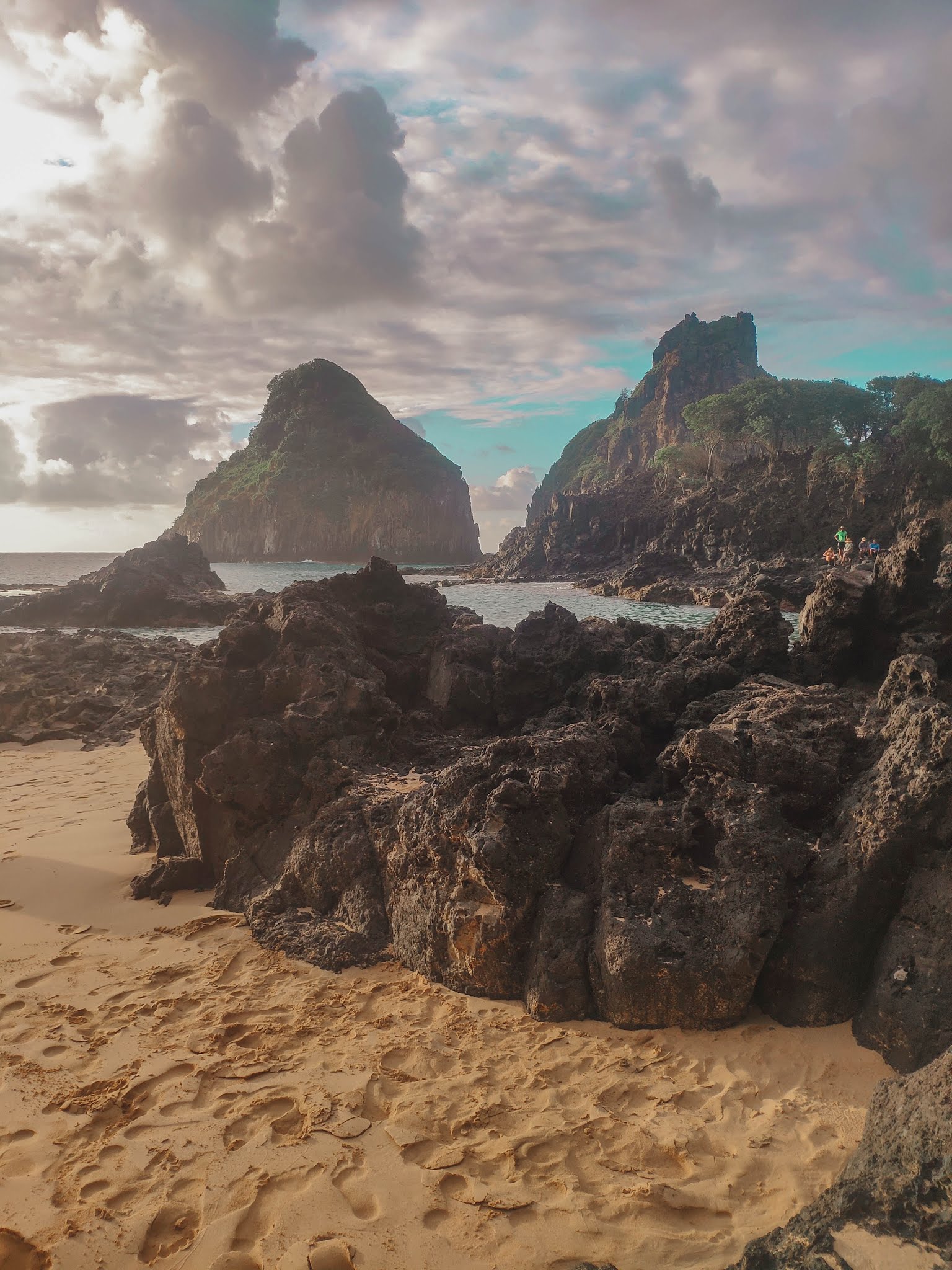 Praia da Baía dos Porcos at sunset, with Morro Dois Irmãos in the backgroun