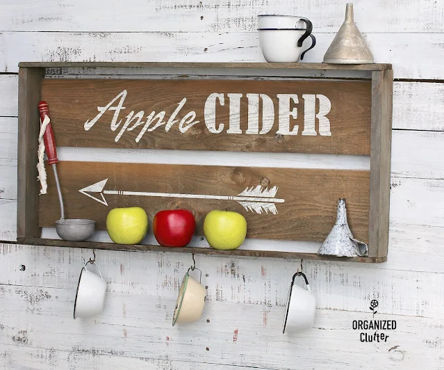 Photo of an apple cider crate/sign/shelf.