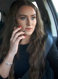 Leah Messer talking on her phone while sitting inside the car