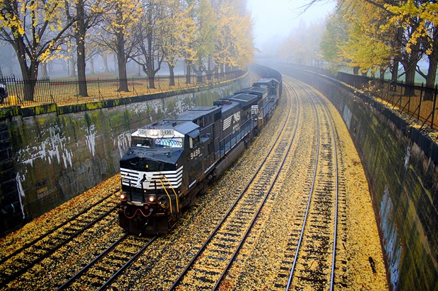 Train goes through the lonely railroad in West Park, Pittsburgh, Pennsylvania, USA while the dense, cold fog hangs on through the morning. 