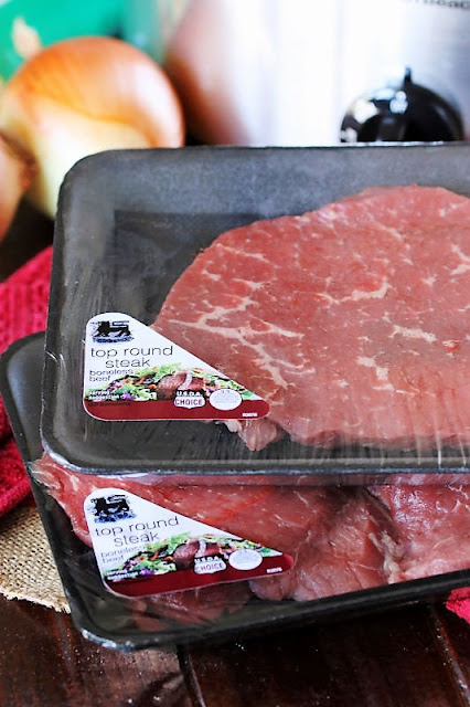  Slices of boneless tumble out circular steak ready upward fork Creamy Crock Pot Round Steak
