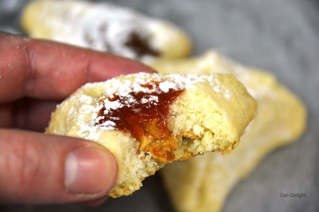 a bite in peanut butter and Jello filled hamantaschen