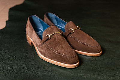 A Pair of Brown Suede Loafer Shoes