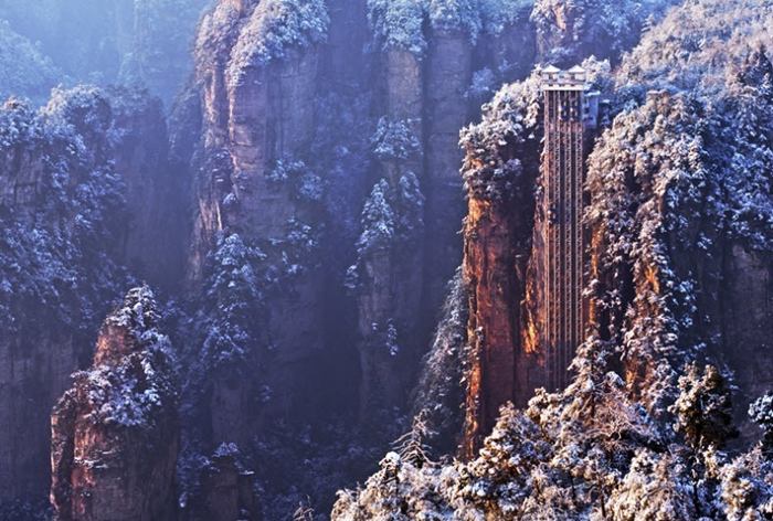 Bailong Elevator built into the side of a huge cliff. Also known as Hundred Dragons Elevator, this glass elevator stands 330 meters tall and is claimed to be the highest and heaviest outdoor elevator in the world. Quite possibly, it is the only elevator in the world that lets people ride up a cliff.