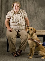 GDB graduate Alma Rodick sits with yellow Lab Guide Dog Shimmer