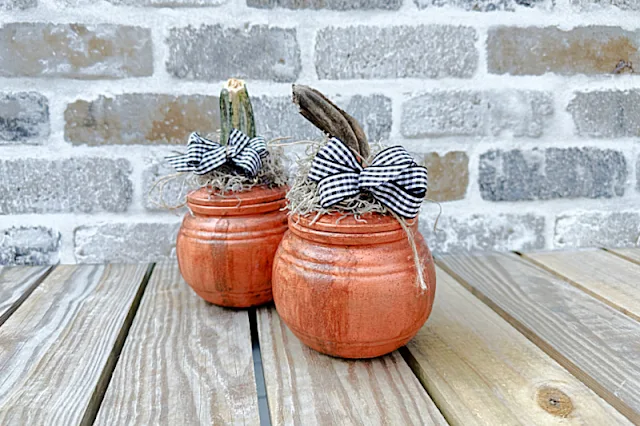 2 pumpkins made from dollar store jars