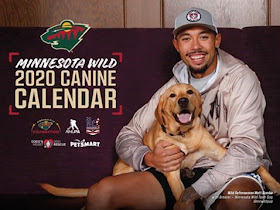 Minnesota Wild 2020 Canine Calendar, with a photo of player holding a dog