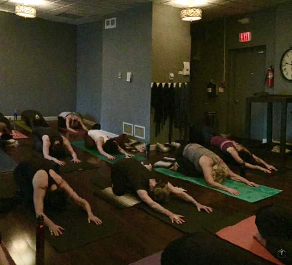 Practicing yoga at samadh, a yoga studio in glenview, Illinois image credit samadhi