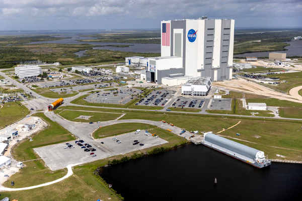 An aerial view of the SLS core stage booster for Artemis 1 being transported to the Vehicle Assembly Building at NASA's Kennedy Space Center in Florida...on April 29, 2021.