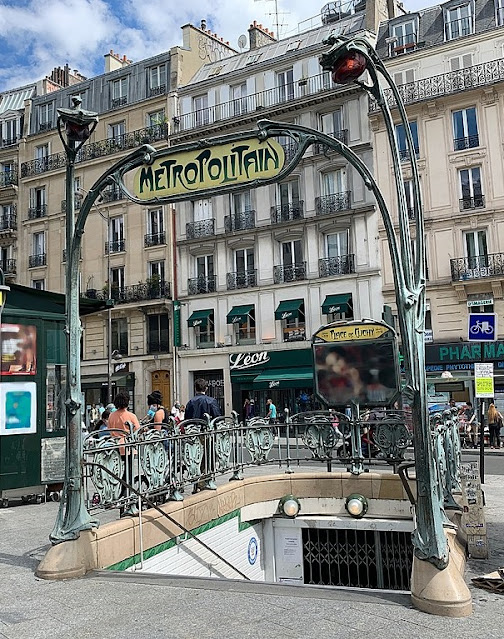 entrance to Place de Clichy metro station with Guimard metalwork