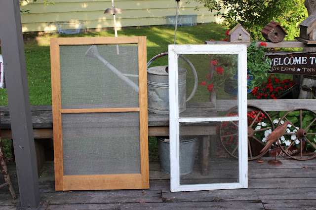 A Stenciled Window Screen with Old Sign Stencils