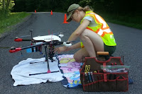 Charlotte Levy examines a drone that will examine albedo before flight. (Credit: cornell.edu) Click to Enlarge.