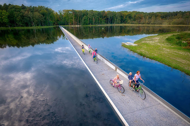 Cycling through water  bokrijk limburg belgium