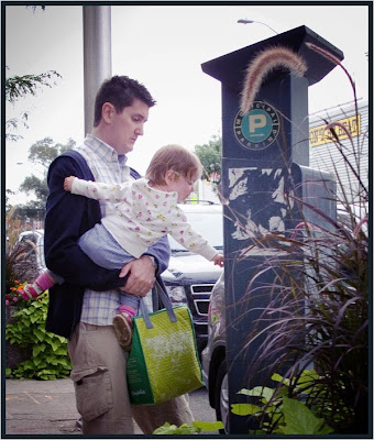 Street portrait of young child getting parking stub